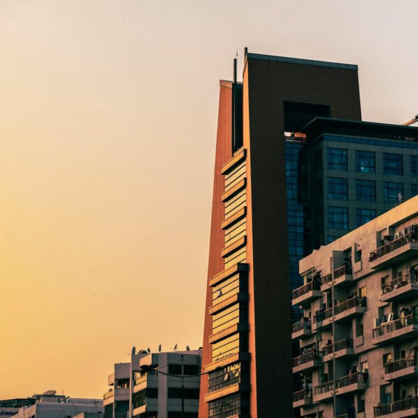 A striking view of Dubai's modern architecture with buildings silhouetted against a sunset sky.